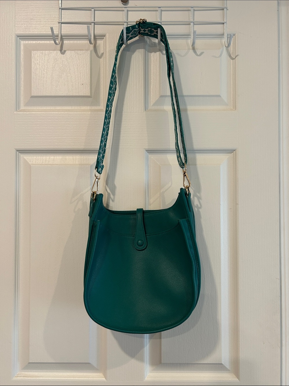 Ah-dorned Teal purse.